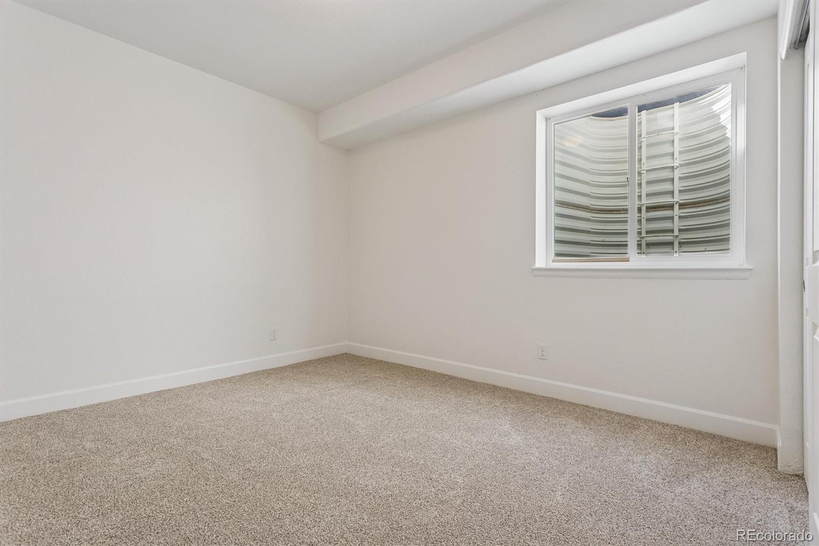 960 Fire Rock Place Colorado Springs, CO 80921 - Photo 24 of 32 an empty room with a window