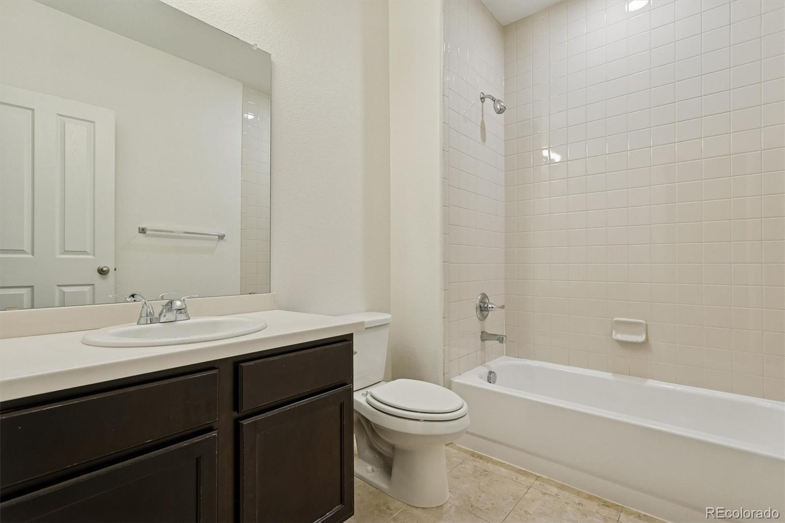 960 Fire Rock Place Colorado Springs, CO 80921 - Photo 25 of 32 a bathroom with a sink a toilet and shower