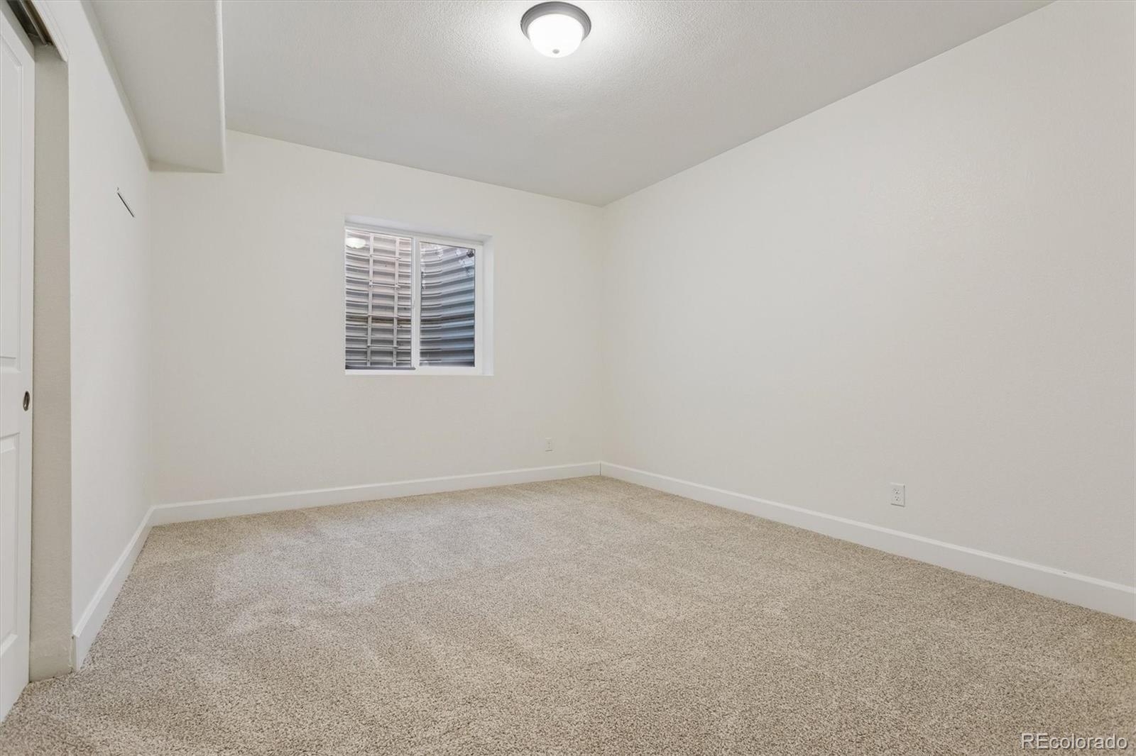 960 Fire Rock Place Colorado Springs, CO 80921 - Photo 26 of 32 an empty room with a window