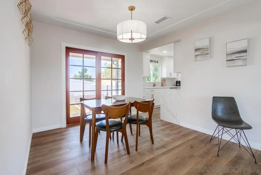 4724 Troy Lane La Mesa, CA 91942 - Photo 18 of 49 a dining room with furniture and wooden floor
