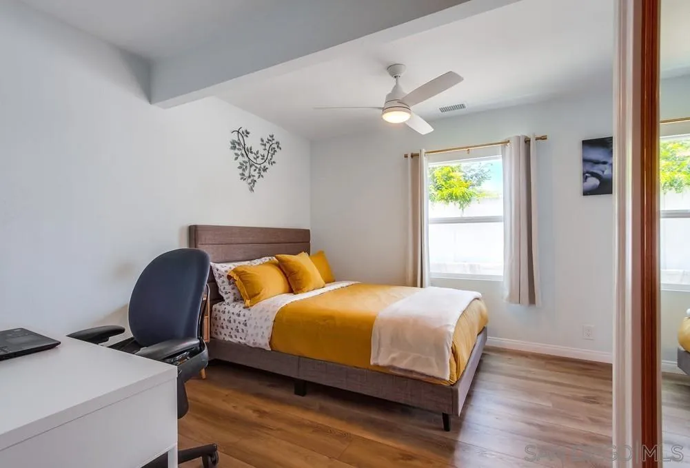 4724 Troy Lane La Mesa, CA 91942 - Photo 22 of 49 a bedroom with a bed and a window
