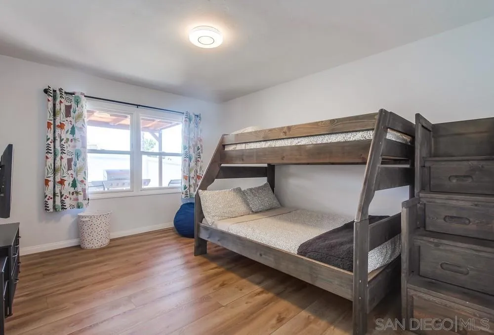 4724 Troy Lane La Mesa, CA 91942 - Photo 27 of 49 a bedroom with a bed and window