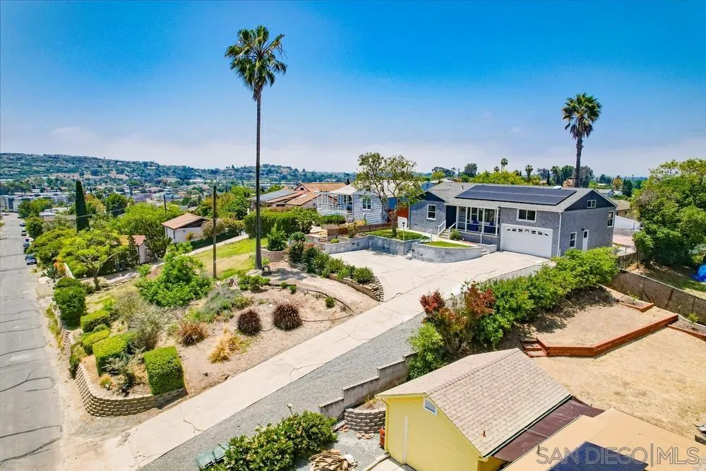 4724 Troy Lane La Mesa, CA 91942 - Photo 46 of 49 a view of a white house with a yard and sitting area