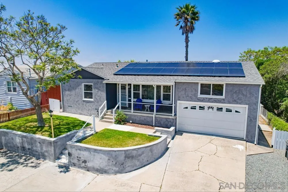 4724 Troy Lane La Mesa, CA 91942 - Photo 7 of 49 a view of a house with a swimming pool and a yard