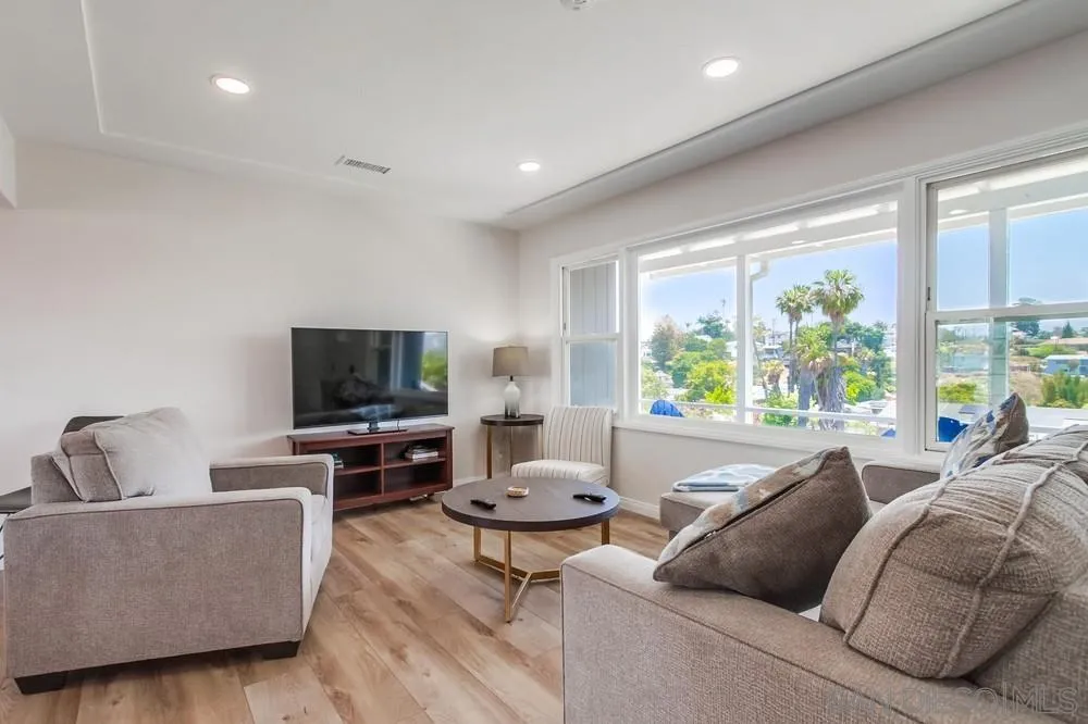4724 Troy Lane La Mesa, CA 91942 - Photo 10 of 49 a living room with furniture and a flat screen tv