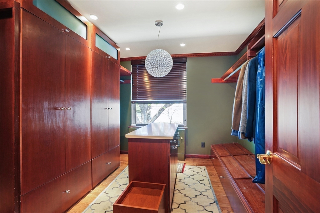 131 Perkins Street, Unit 131 Boston, MA 02130 - Photo 15 of 21 a bathroom with a sink a mirror and a shower