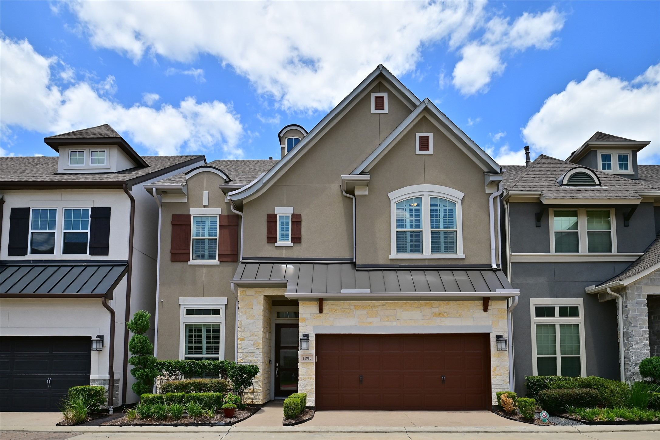 a front view of a house with a garage