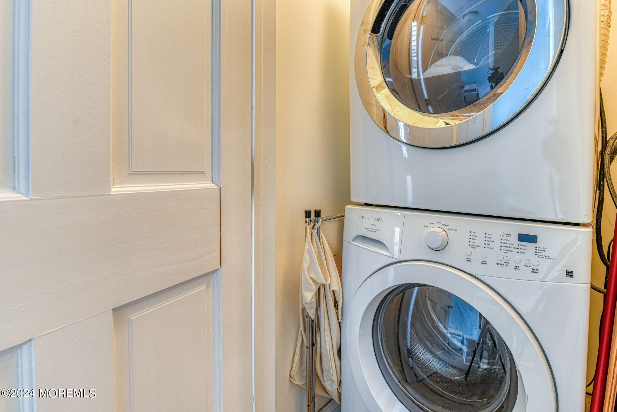 18 Abbott Avenue, Unit GARDEN Ocean Grove, NJ 07756 - Photo 14 of 16 a close view of a utility room with dryer and washer