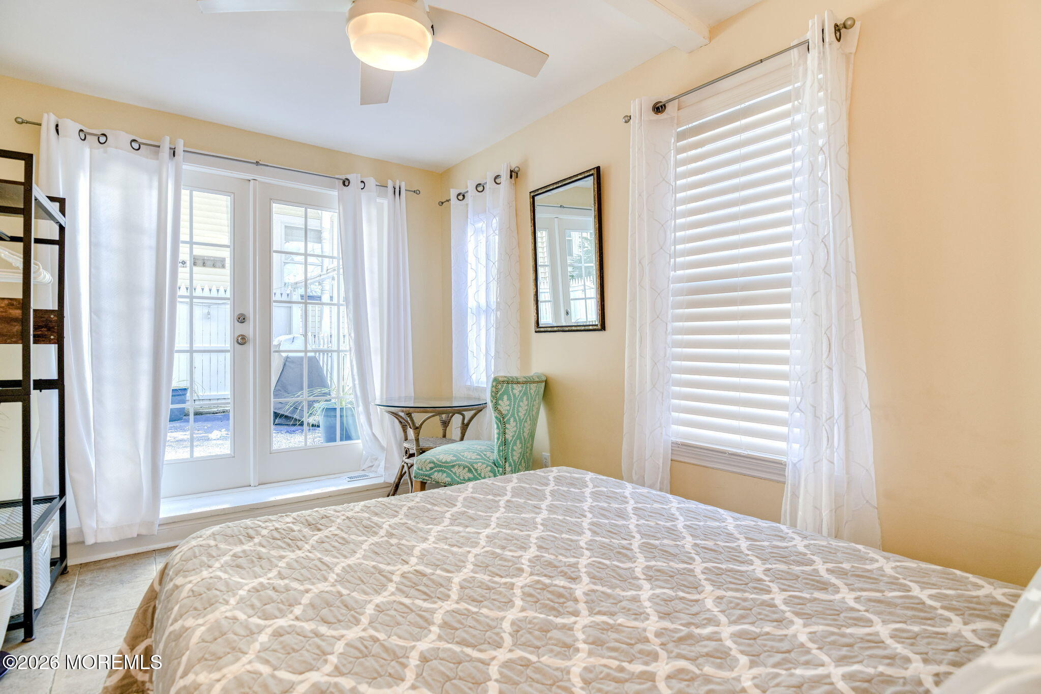 18 Abbott Avenue, Unit GARDEN Ocean Grove, NJ 07756 - Photo 16 of 16 a bedroom with a large bed and a window