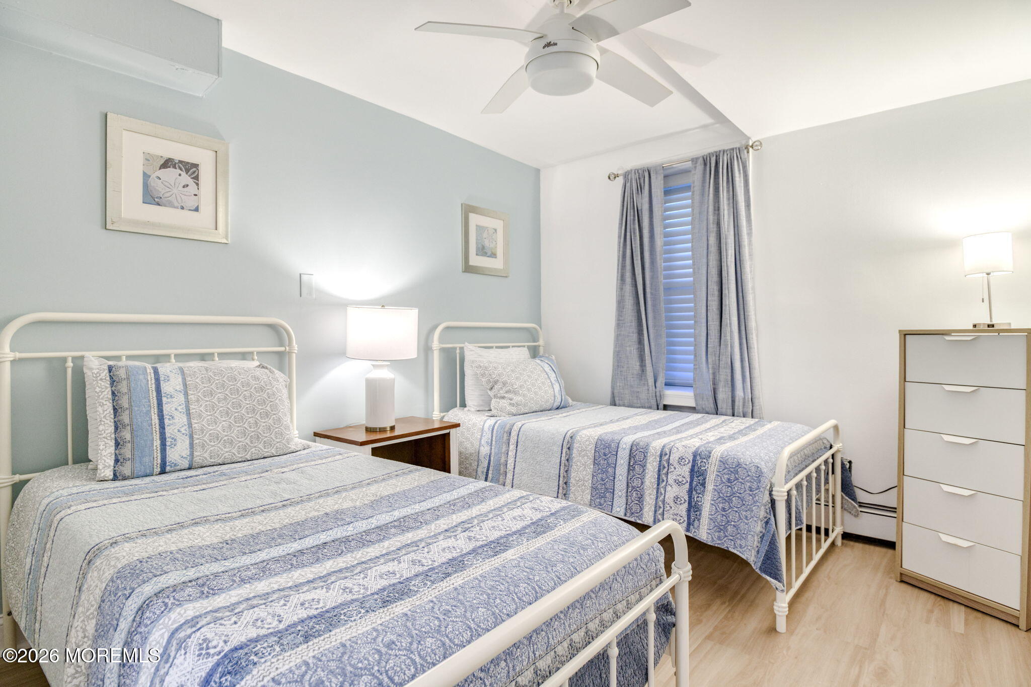 18 Abbott Avenue, Unit GARDEN Ocean Grove, NJ 07756 - Photo 9 of 16 a bedroom with two beds and painting on the wall