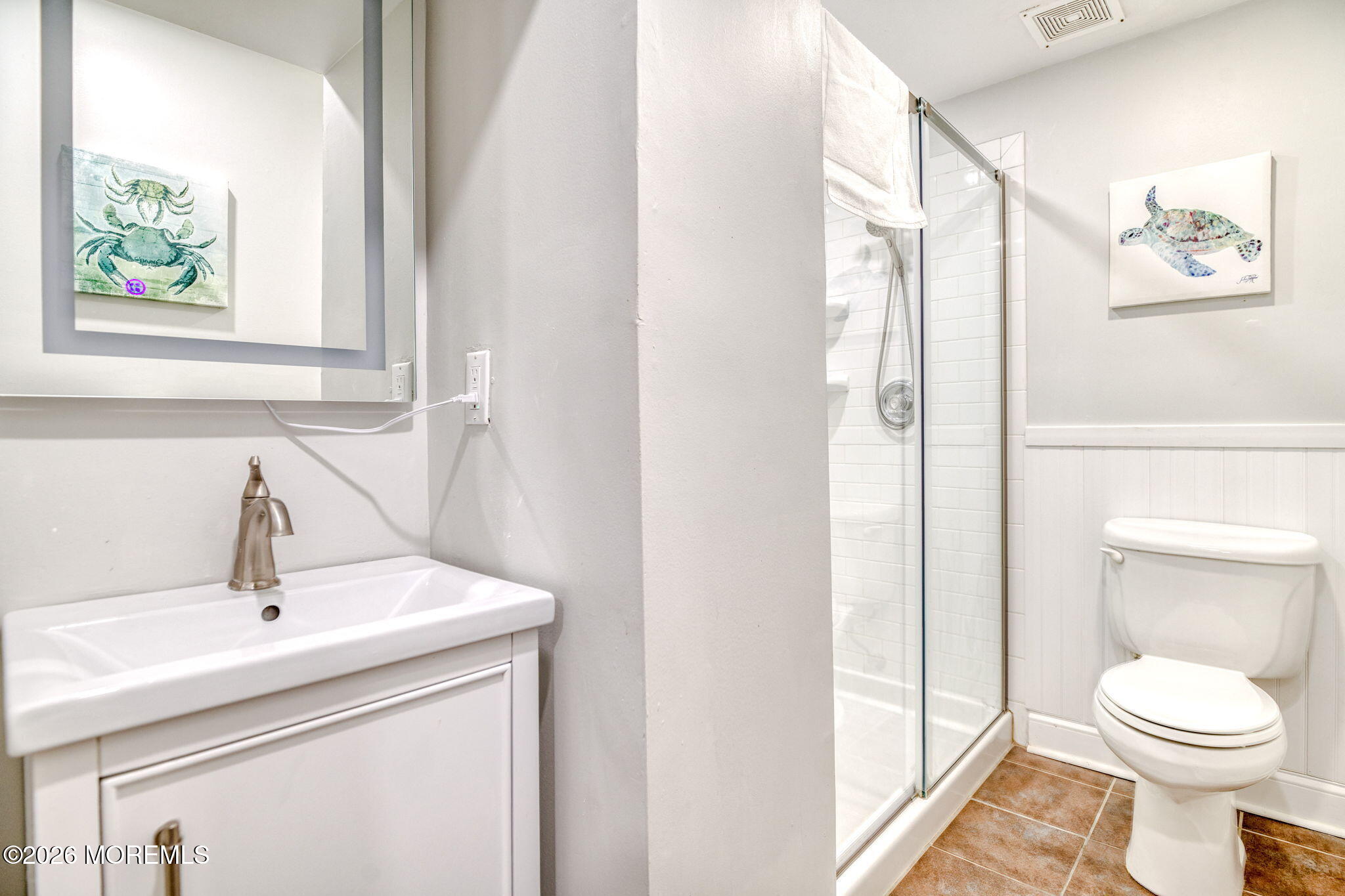 18 Abbott Avenue, Unit GARDEN Ocean Grove, NJ 07756 - Photo 10 of 16 a bathroom with a toilet a sink and a window
