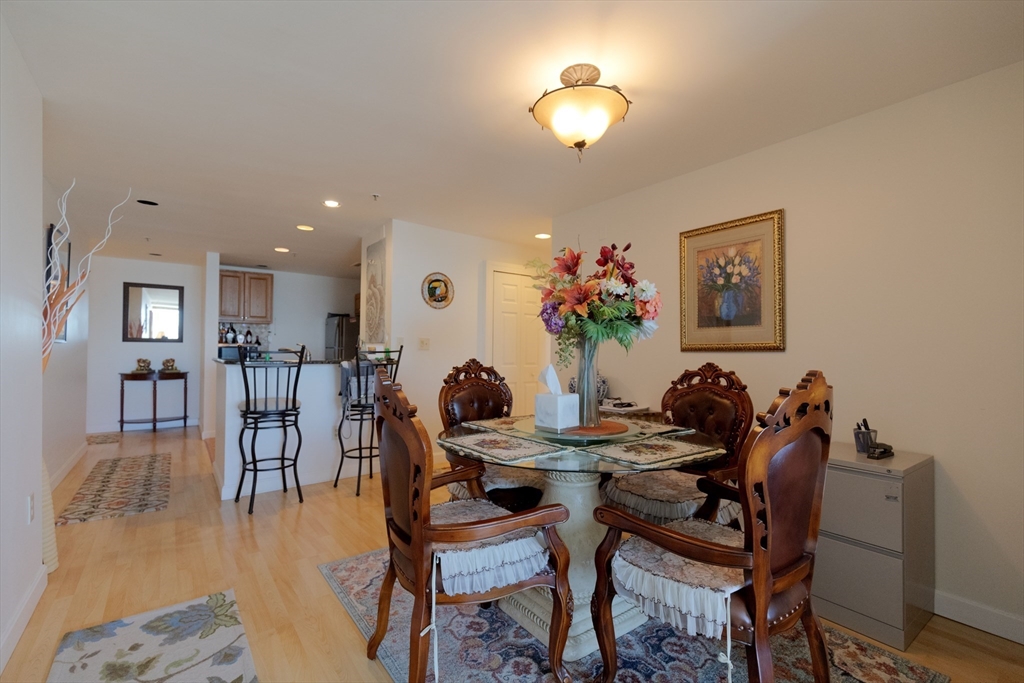 a view of a dining room with furniture and a chandelier