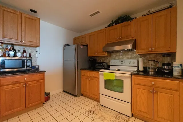 a view of a livingroom with furniture and a window