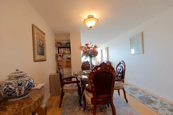 a view of a hallway with chairs