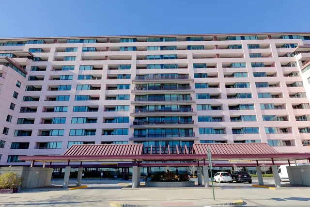 a front view of a building with glass windows