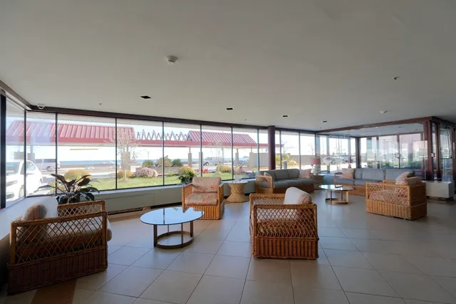 a view of a living room and dining room