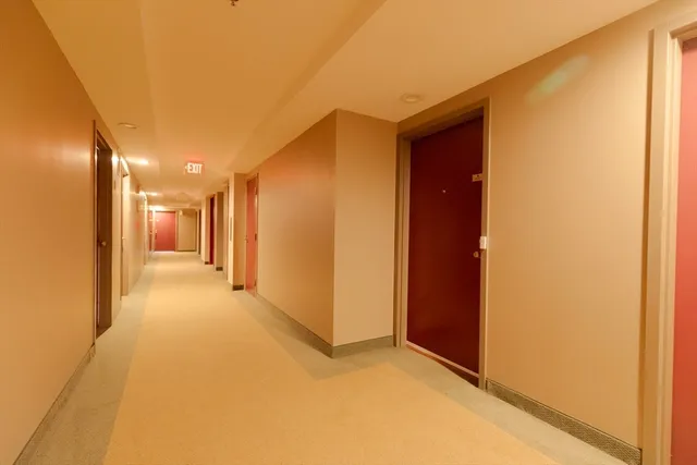 a view of hallway with a large window