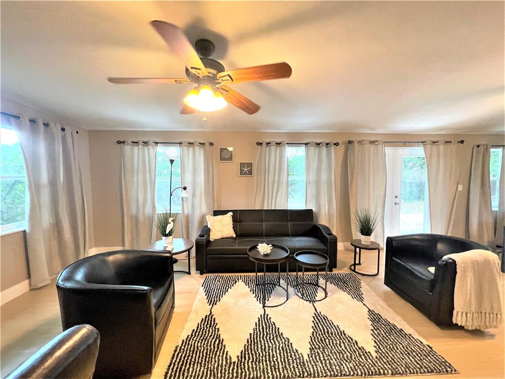 5106 104th Street North St. Petersburg, FL 33708 - Photo 14 of 35 a living room with furniture and a window