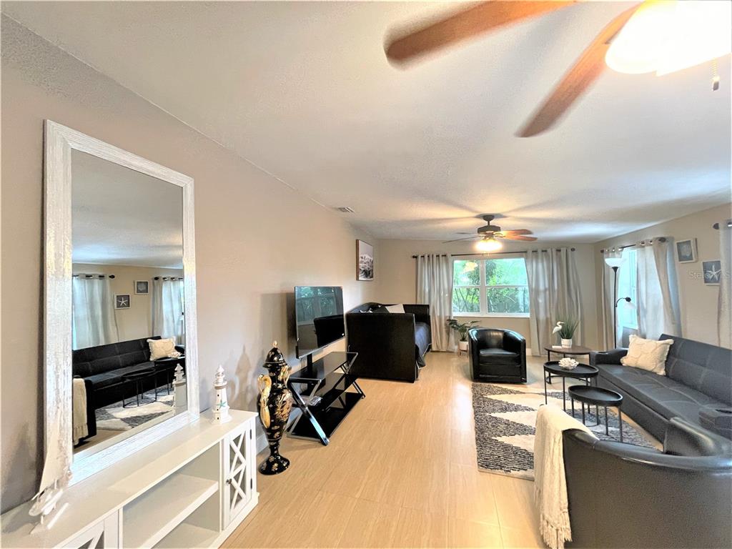 5106 104th Street North St. Petersburg, FL 33708 - Photo 15 of 35 a living room with furniture and a large window