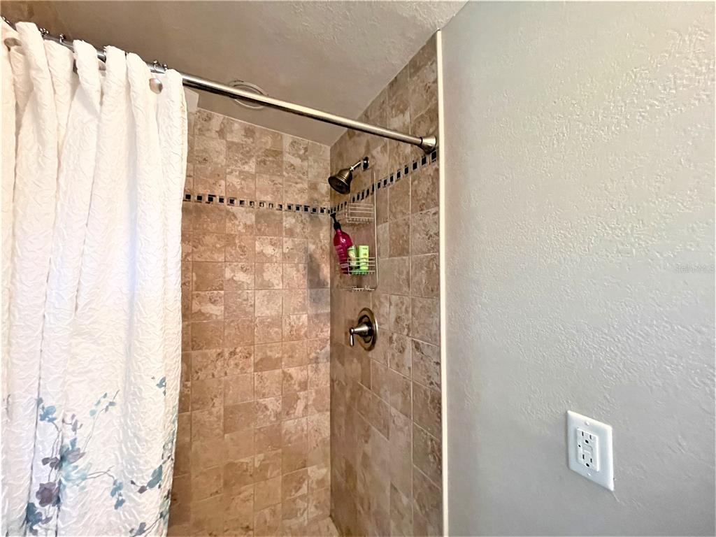5106 104th Street North St. Petersburg, FL 33708 - Photo 19 of 35 a bathroom with a shower