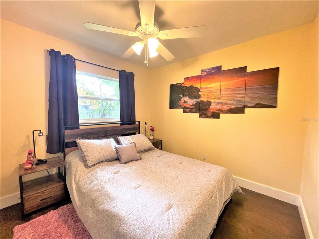 5106 104th Street North St. Petersburg, FL 33708 - Photo 20 of 35 a bedroom with a bed and window