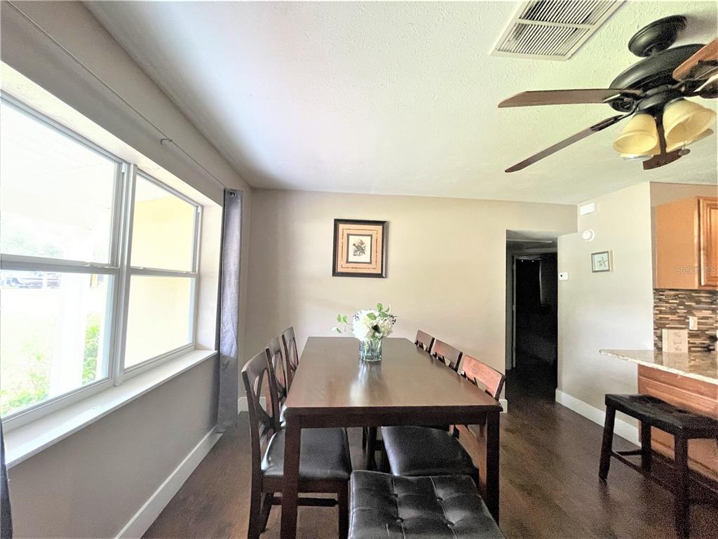 5106 104th Street North St. Petersburg, FL 33708 - Photo 7 of 35 a view of a dining room with furniture window and outside view