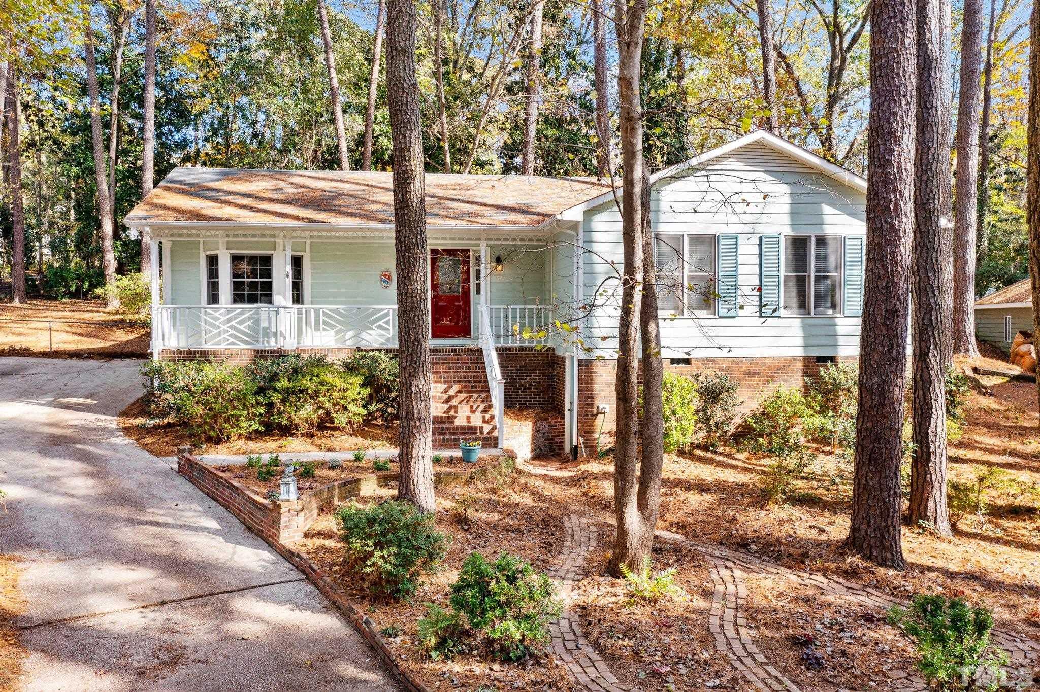 805 Nuttree Place Raleigh, NC 27606 - Photo 3 of 34 a front view of a house with a porch