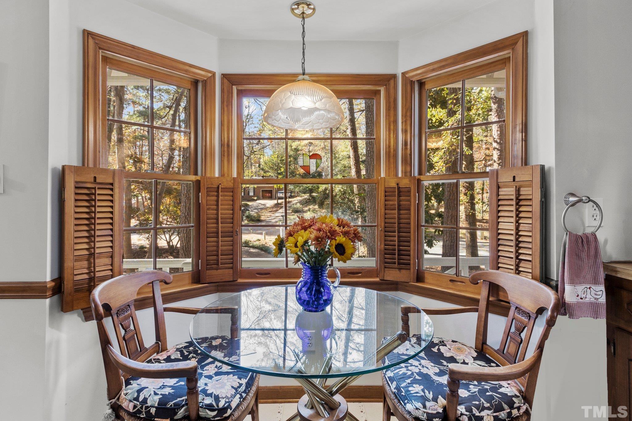 805 Nuttree Place Raleigh, NC 27606 - Photo 8 of 34 a view of a dining room with furniture window and outside view