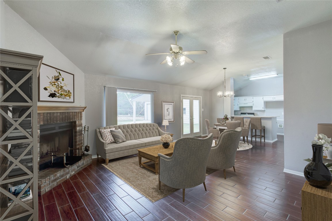 a living room with furniture a fireplace and a flat screen tv