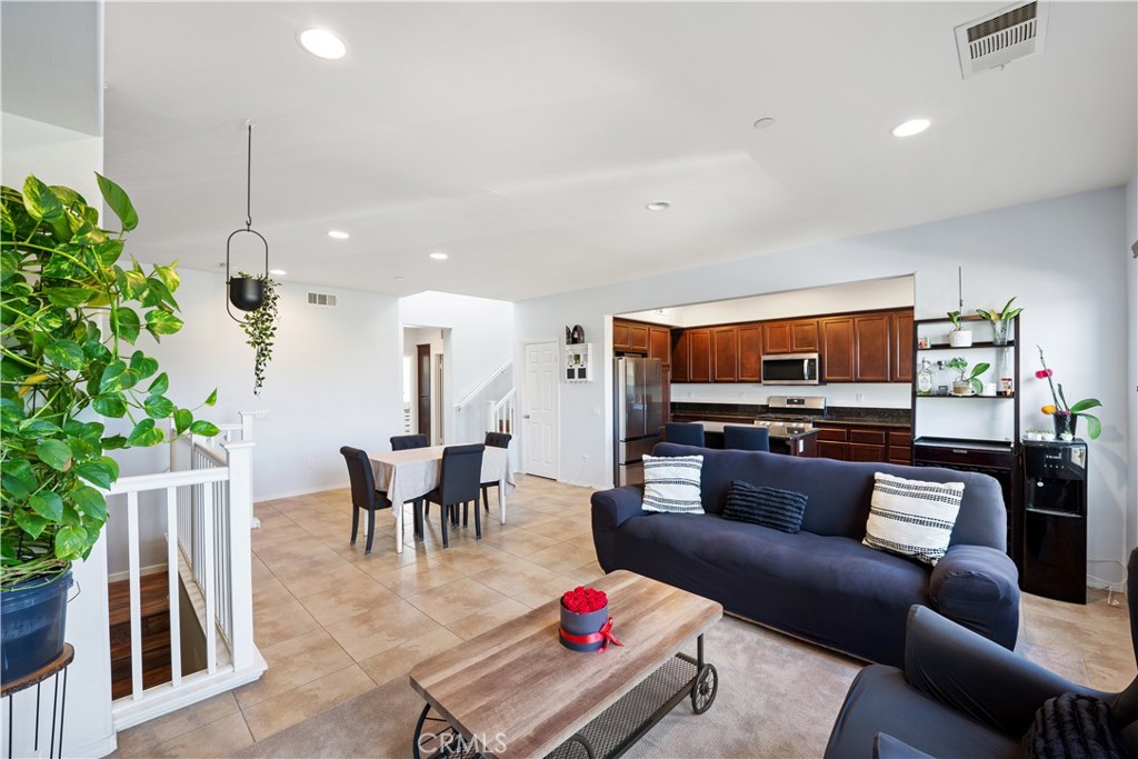 3108 North Oxnard Boulevard Oxnard, CA 93036 - Photo 10 of 40 a living room with furniture and a potted plant