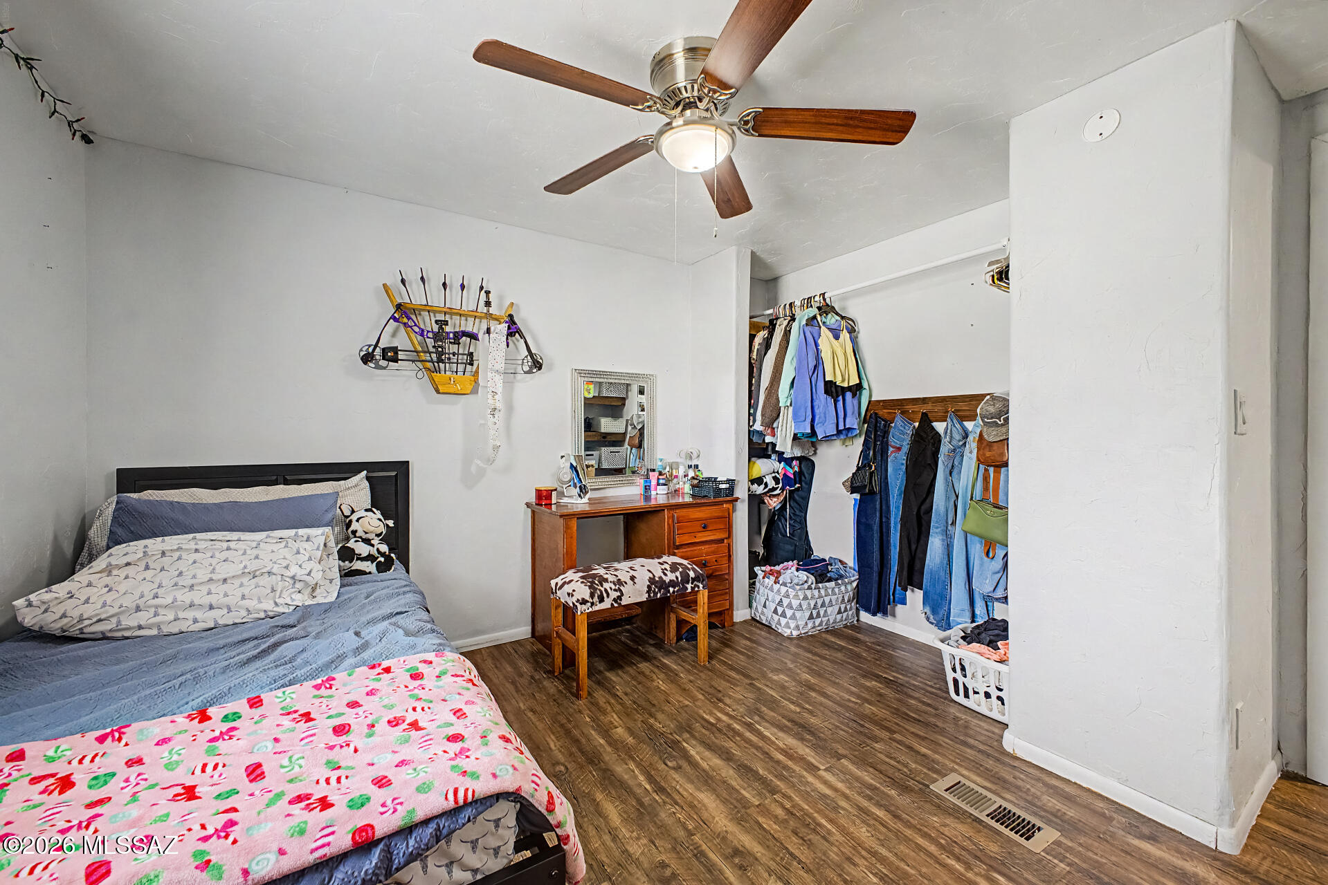 4231 East Pinal Street Tucson, AZ 85739 - Photo 15 of 36 a bedroom with furniture and a window