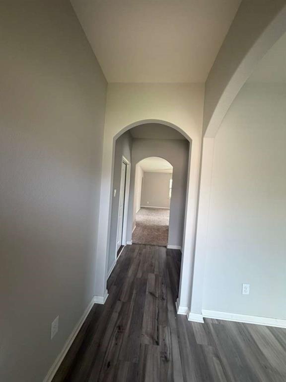 310 Foster Lane Anna, TX 75409 - Photo 5 of 15 Archway entry featuring wood-finish flooring and neutral wall tones