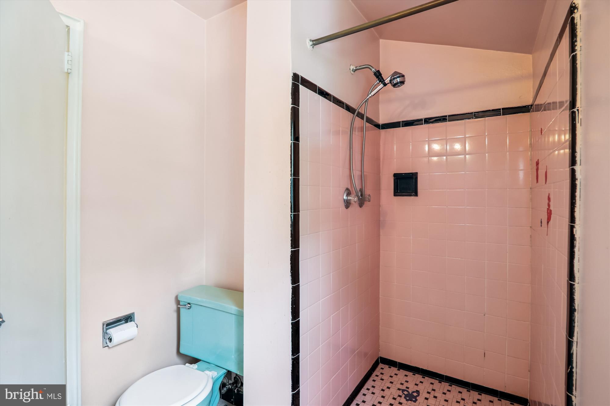 9507 Adelphi Road Silver Spring, MD 20903 - Photo 28 of 41 a bathroom with a toilet and a shower
