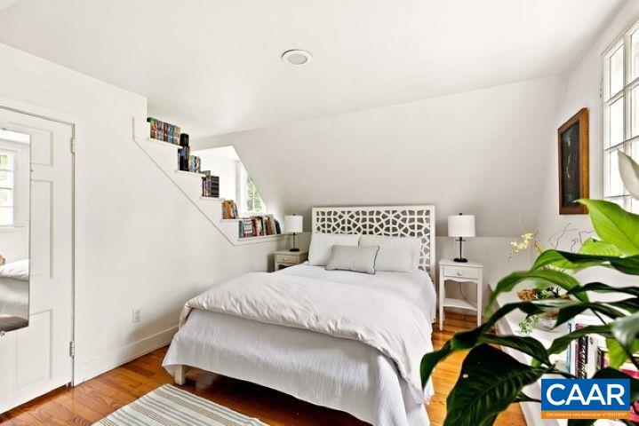 123 Cameron Lane Charlottesville, VA 22903 - Photo 23 of 43 a bedroom with a bed and a potted plant