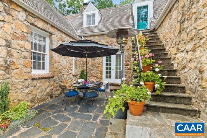 123 Cameron Lane Charlottesville, VA 22903 - Photo 27 of 43 a view of a patio with chairs and potted plants