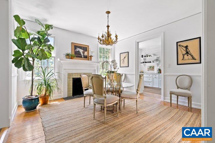 123 Cameron Lane Charlottesville, VA 22903 - Photo 5 of 43 a dining room with furniture a chandelier and wooden floor