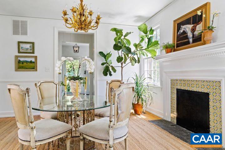 123 Cameron Lane Charlottesville, VA 22903 - Photo 7 of 43 a dining room with furniture potted plants and wooden floor