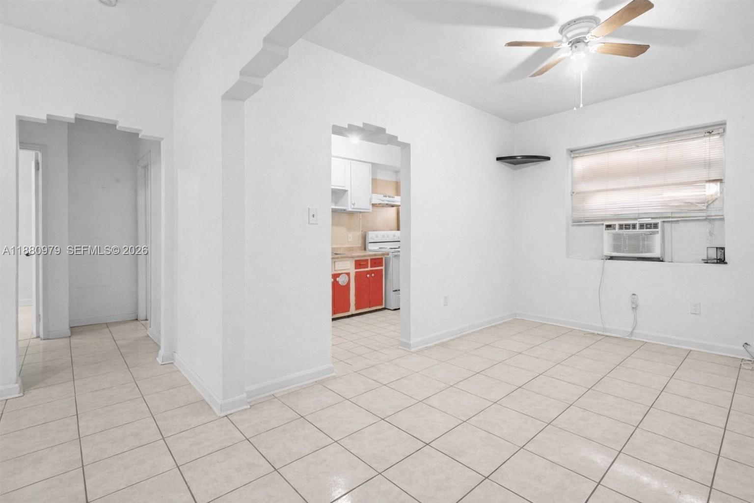 1345 Southwest 7th Street Miami, FL 33135 - Photo 11 of 37 an empty room with fan and windows