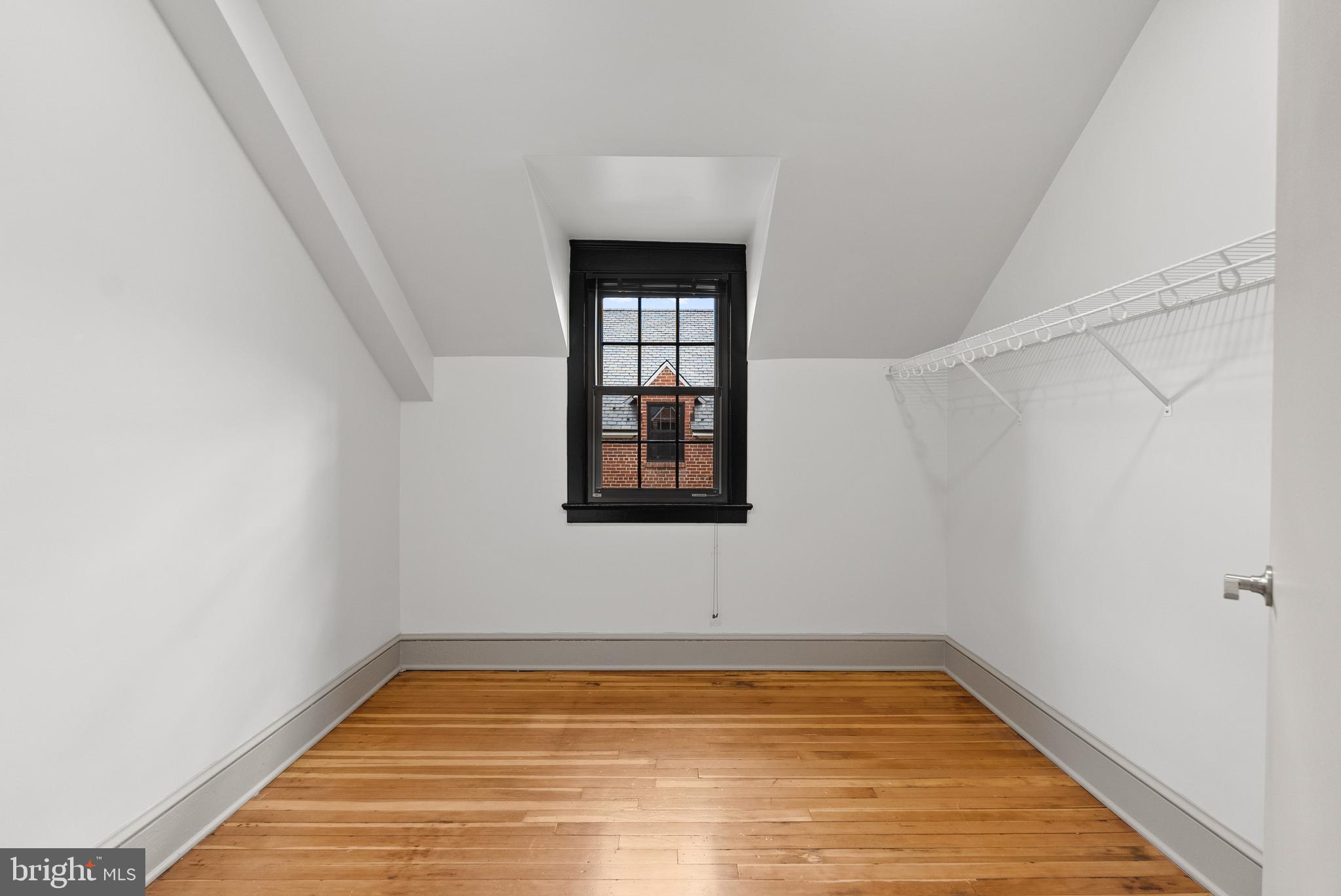 9071 Power House Road, Unit 102 Lorton, VA 22079 - Photo 29 of 50 a view of empty room with wooden floor and fan