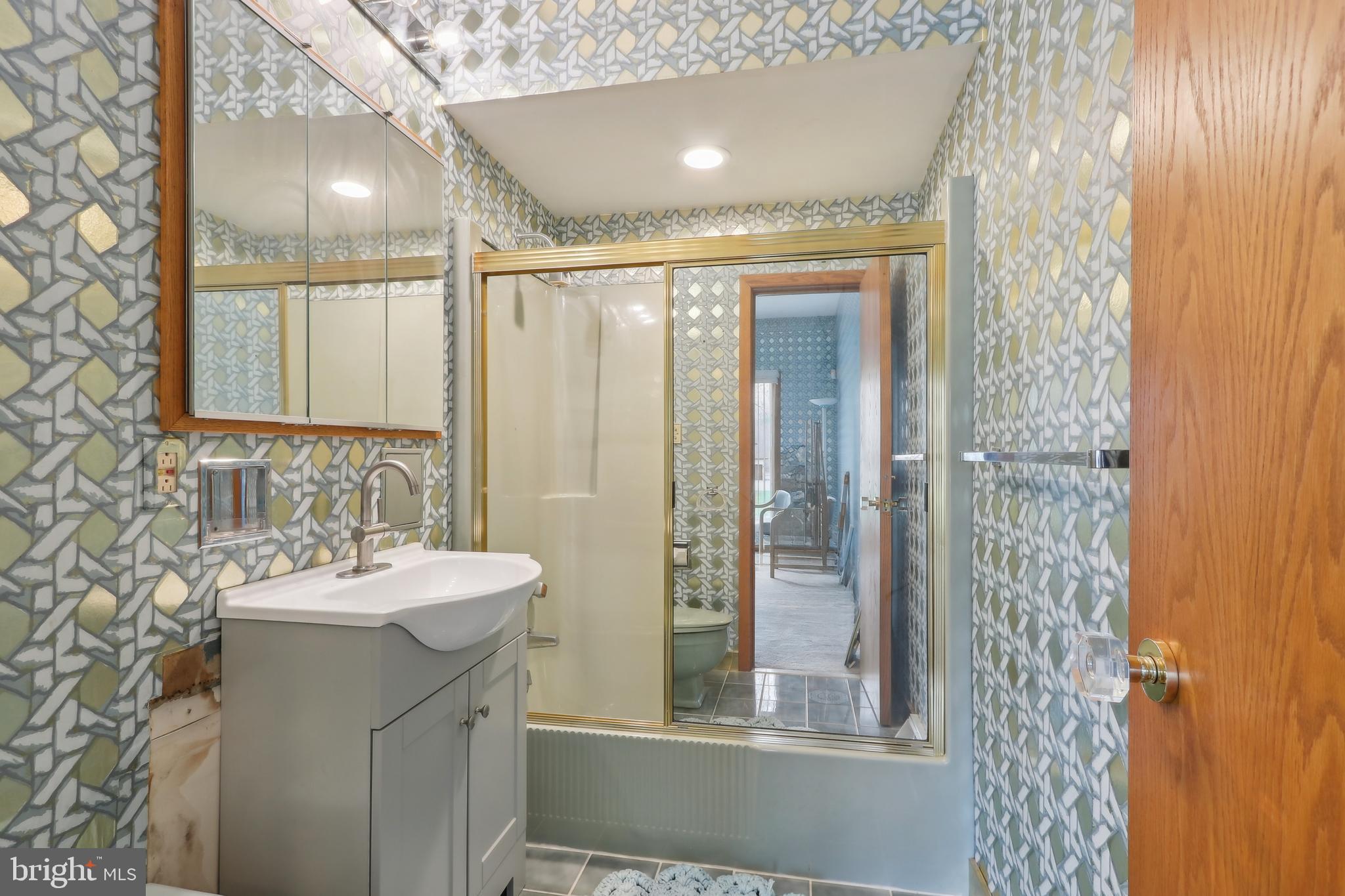 27 Cannon Range Road Milmay, NJ 08340 - Photo 50 of 95 a bathroom with a sink and a mirror