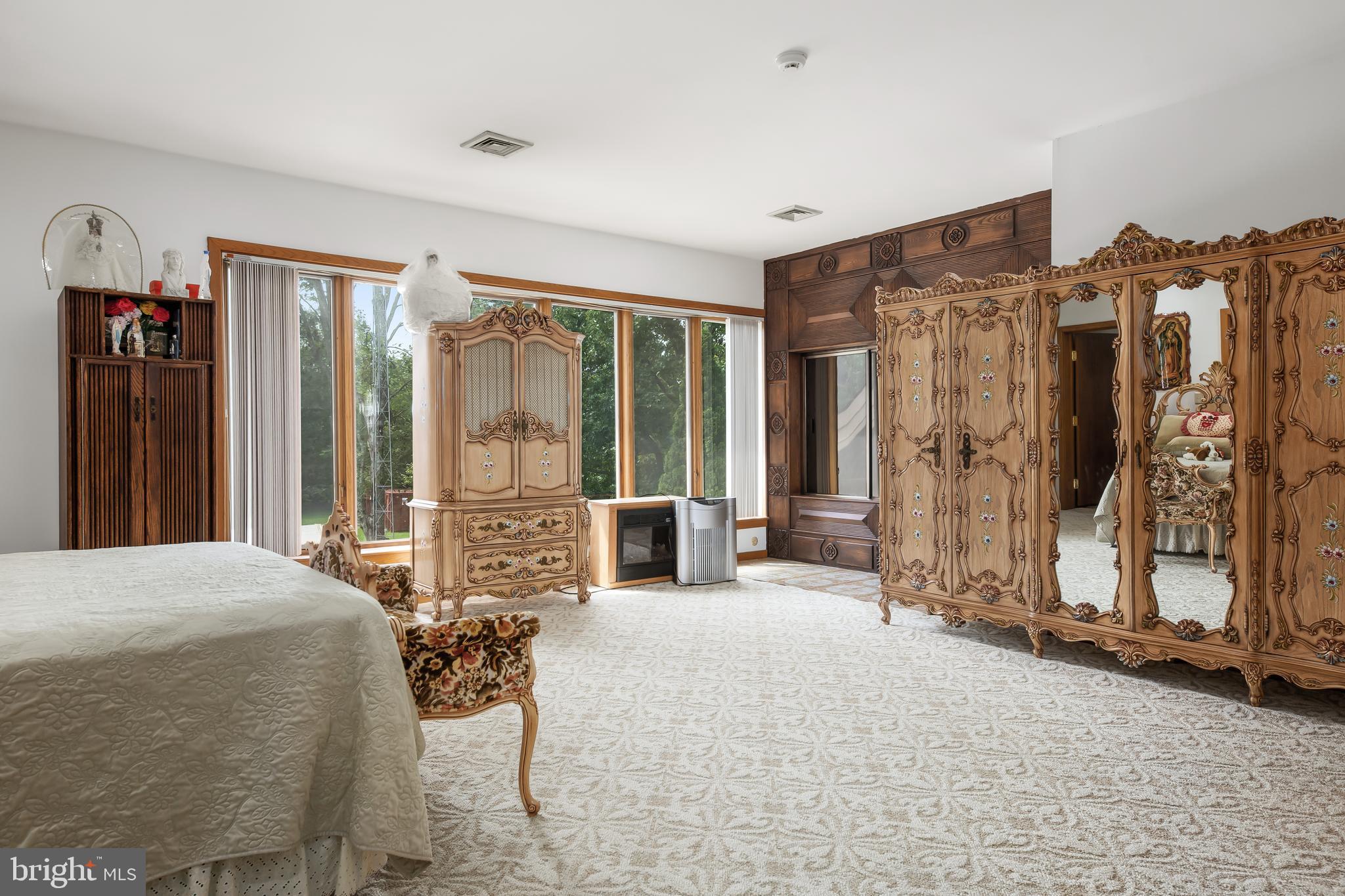 27 Cannon Range Road Milmay, NJ 08340 - Photo 87 of 95 a bedroom with a bed and large windows