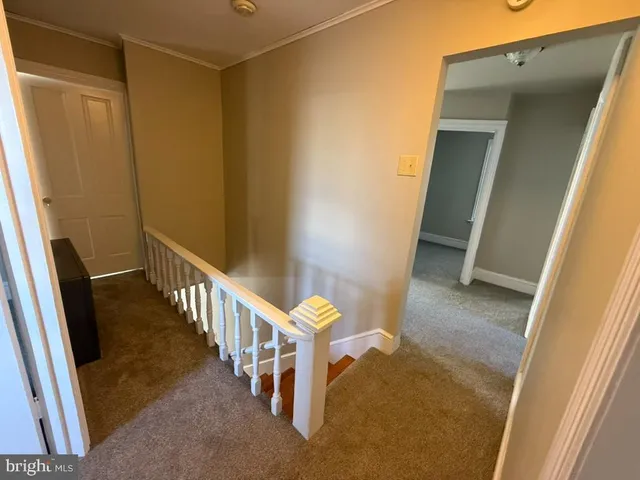 a view of a hallway with staircase