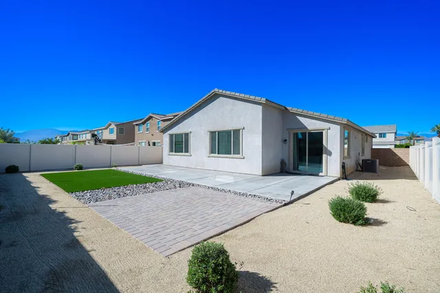 a front view of a house with garage