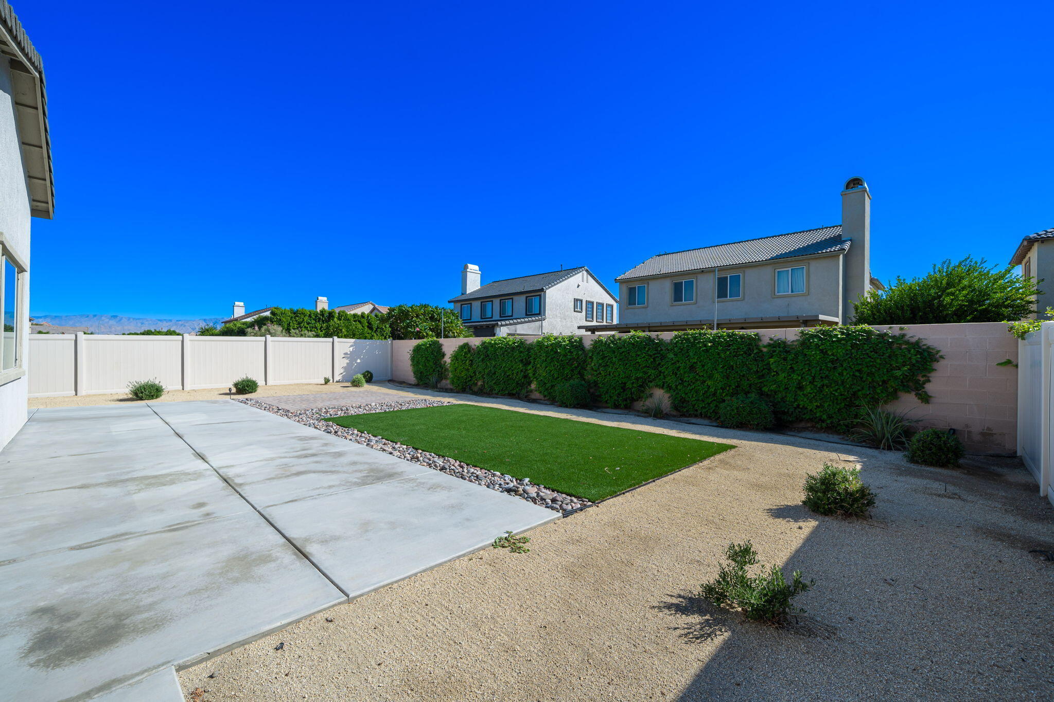 50252 Paseo Barcelona Coachella, CA 92236 - Photo 18 of 23 a view of a house with a yard and a garage
