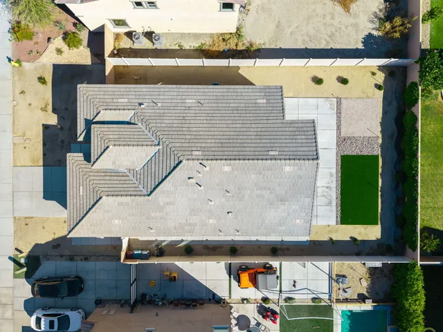 an aerial view of a building with parking