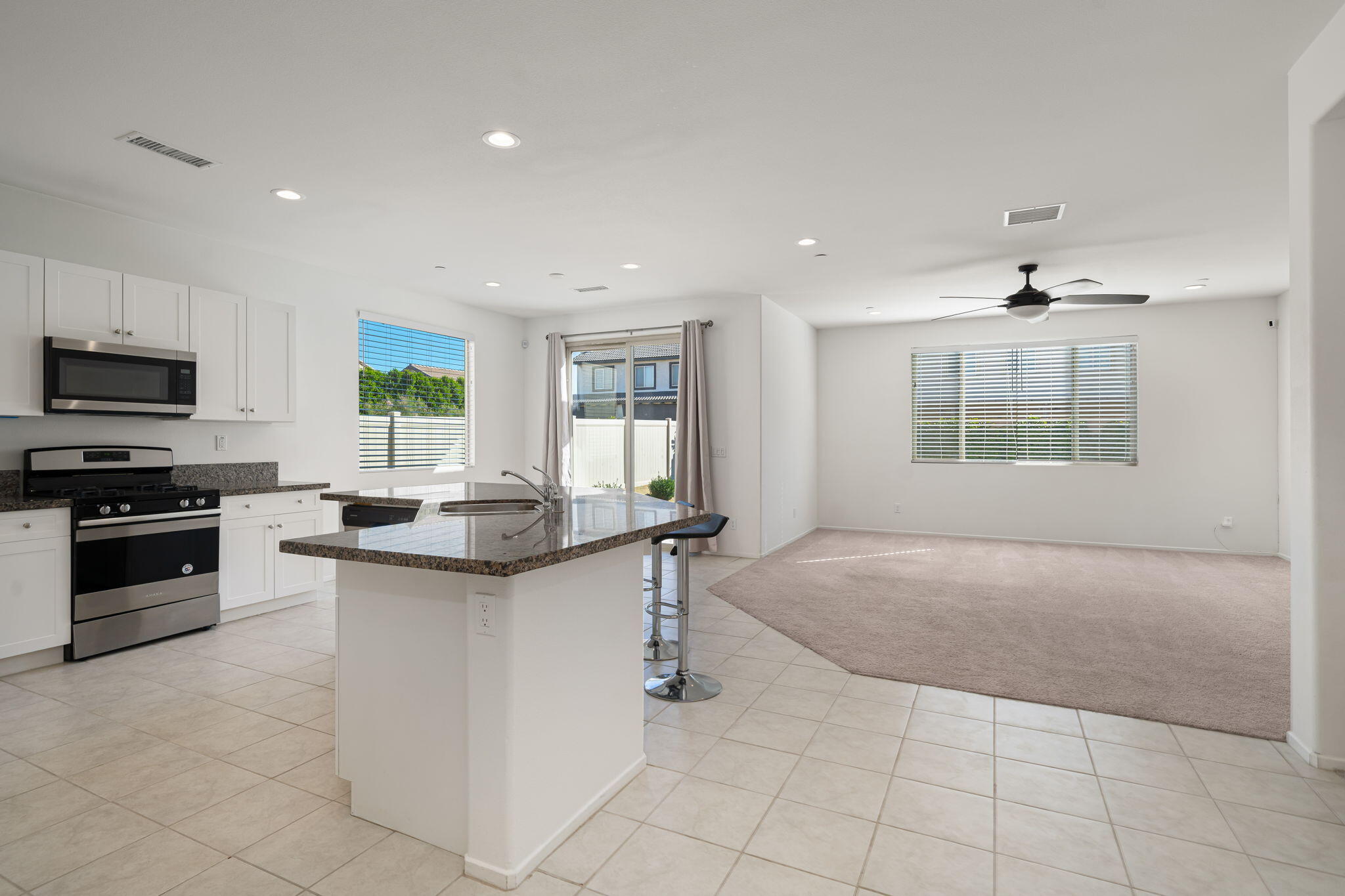 50252 Paseo Barcelona Coachella, CA 92236 - Photo 7 of 23 a kitchen with stainless steel appliances granite countertop a stove and a sink