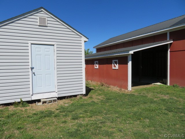 15212 Wilkinson Road Dinwiddie, VA 23841 - Photo 12 of 46 a front view of a house with a yard