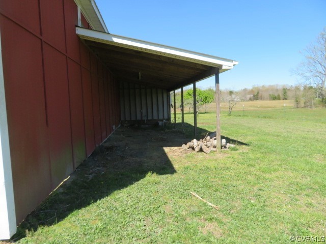 15212 Wilkinson Road Dinwiddie, VA 23841 - Photo 14 of 46 a view of a backyard of the house