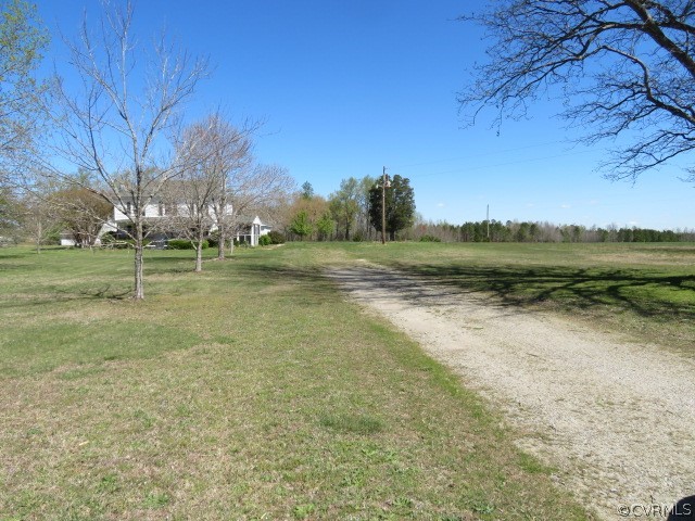 15212 Wilkinson Road Dinwiddie, VA 23841 - Photo 16 of 46 a view of a field with a building in the background