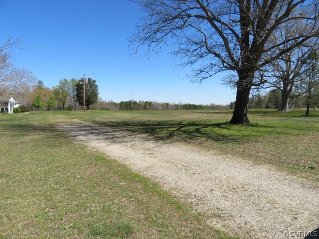 15212 Wilkinson Road Dinwiddie, VA 23841 - Photo 18 of 46 a view of a field with an trees